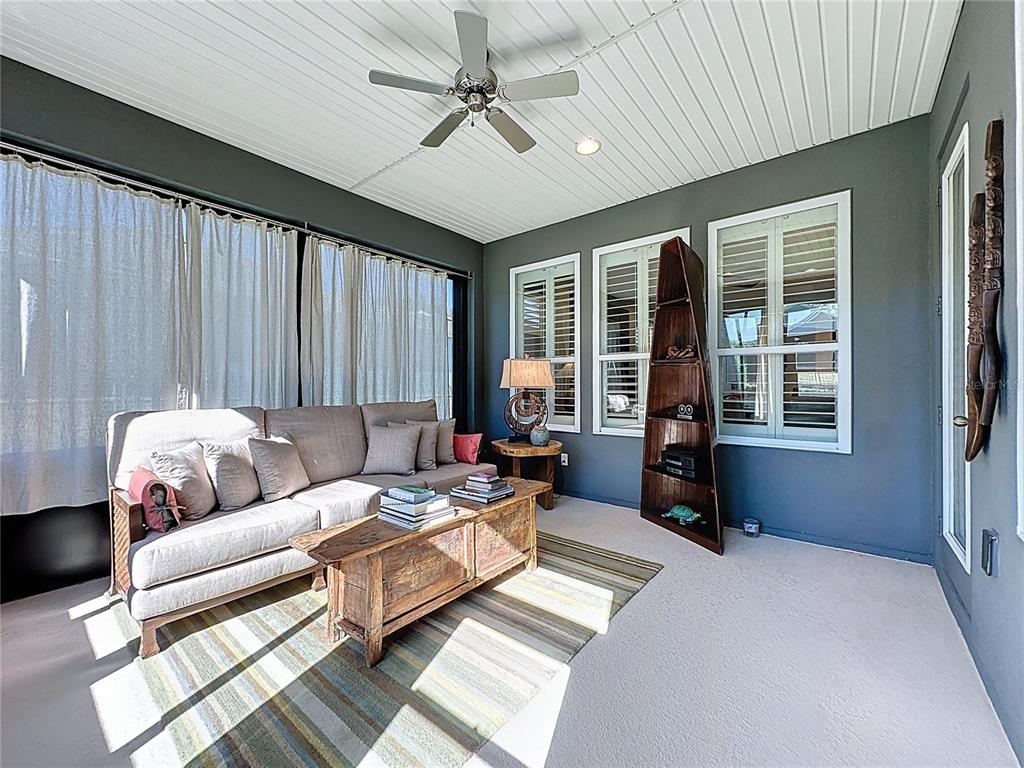 404 Silver Maple Road Groveland, FL 34736 - Photo 35 of 40 a living room with furniture and a large window