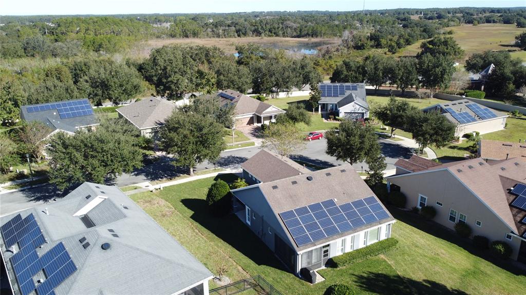 404 Silver Maple Road Groveland, FL 34736 - Photo 36 of 40 an aerial view of a house with a yard