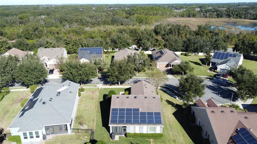 404 Silver Maple Road Groveland, FL 34736 - Photo 38 of 40 an aerial view of multiple houses with yard