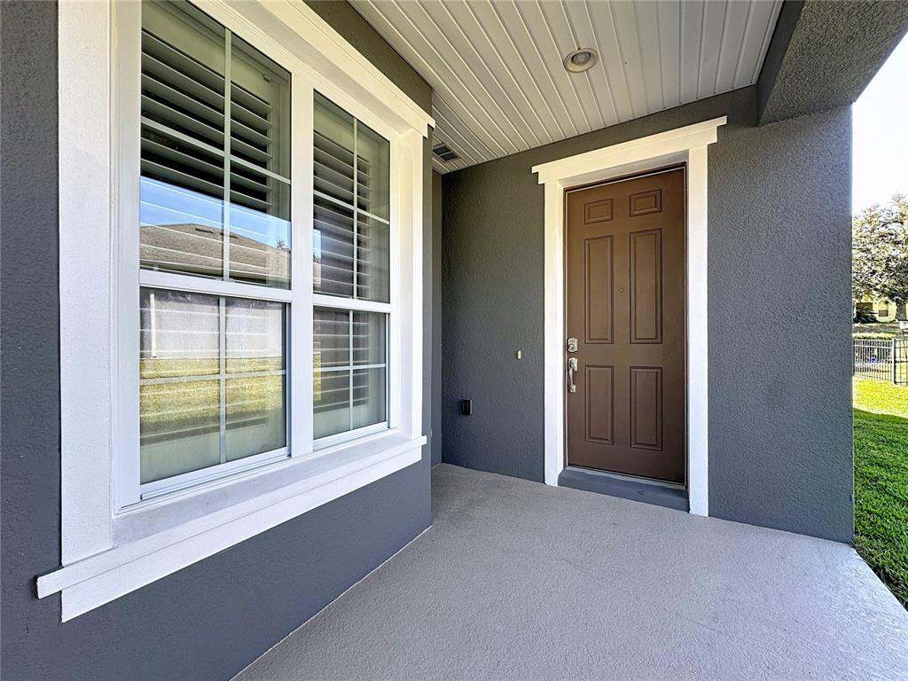 404 Silver Maple Road Groveland, FL 34736 - Photo 4 of 40 a view of an empty room with a window
