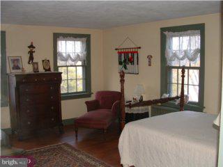 98 Quinton Alloway Road Quinton, NJ 08079 - Photo 6 of 6 a bedroom with a bed and a window
