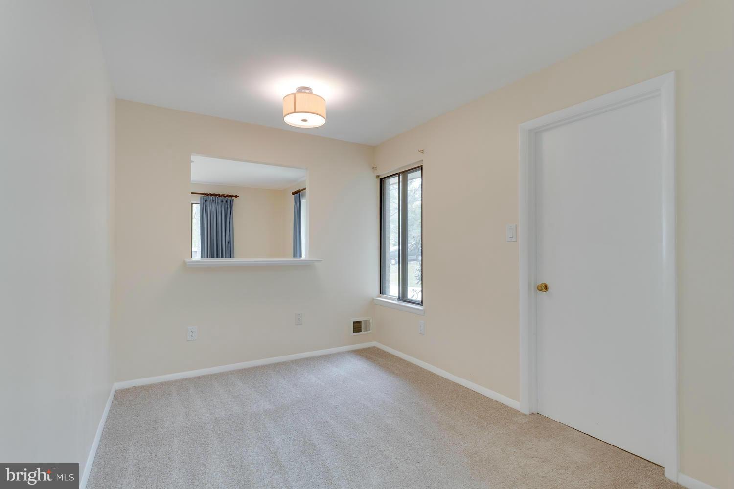 12348 Lima Lane Reston, VA 20191 - Photo 14 of 26 a view of an empty room with a window