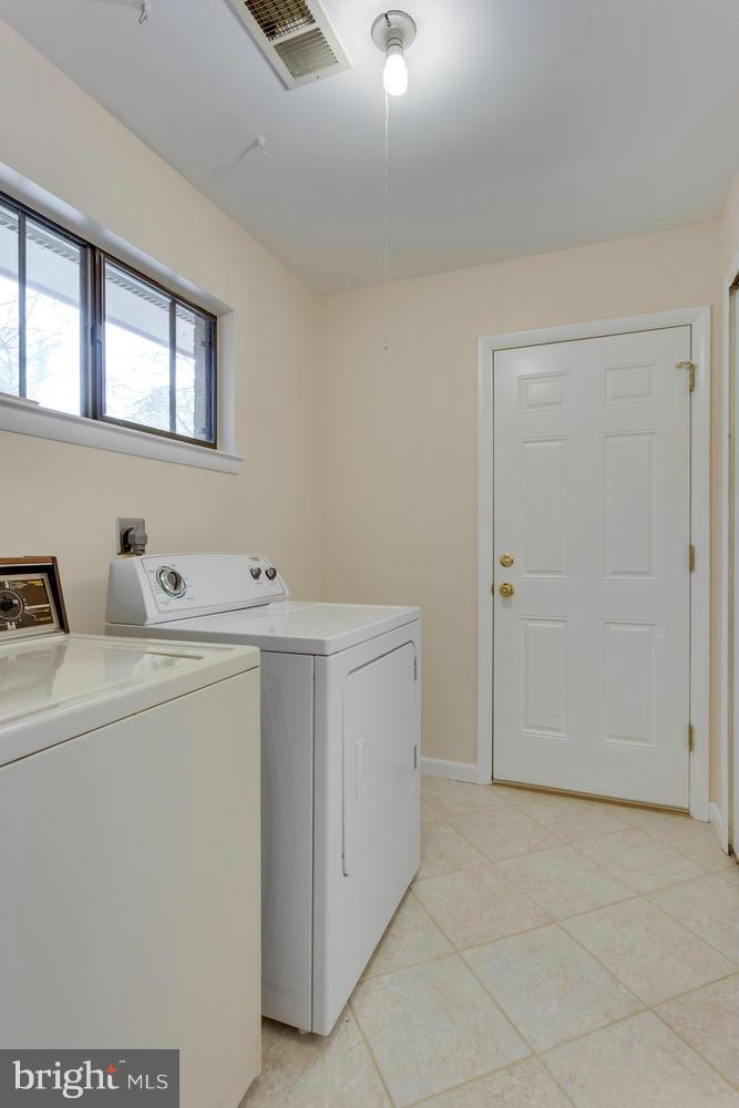 12348 Lima Lane Reston, VA 20191 - Photo 15 of 26 a utility room with dryer and washer