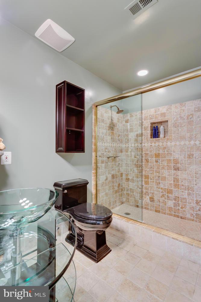 12348 Lima Lane Reston, VA 20191 - Photo 19 of 26 a living room with a couch and a table