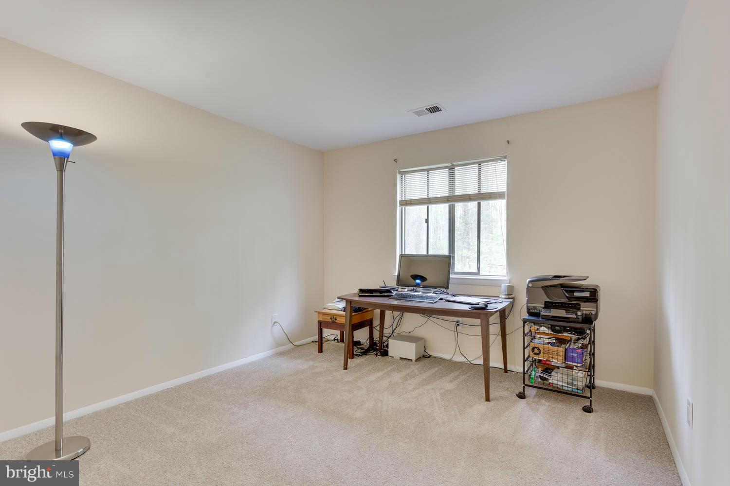 12348 Lima Lane Reston, VA 20191 - Photo 22 of 26 a view of a workspace with furniture and a window