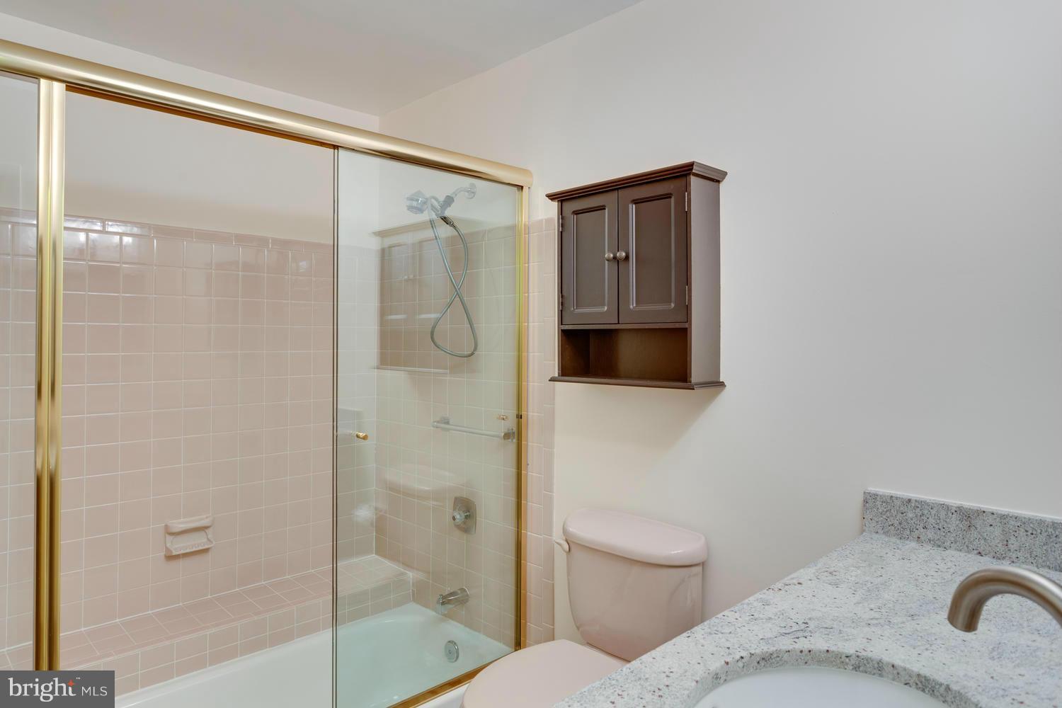 12348 Lima Lane Reston, VA 20191 - Photo 23 of 26 a bathroom with a toilet and a shower