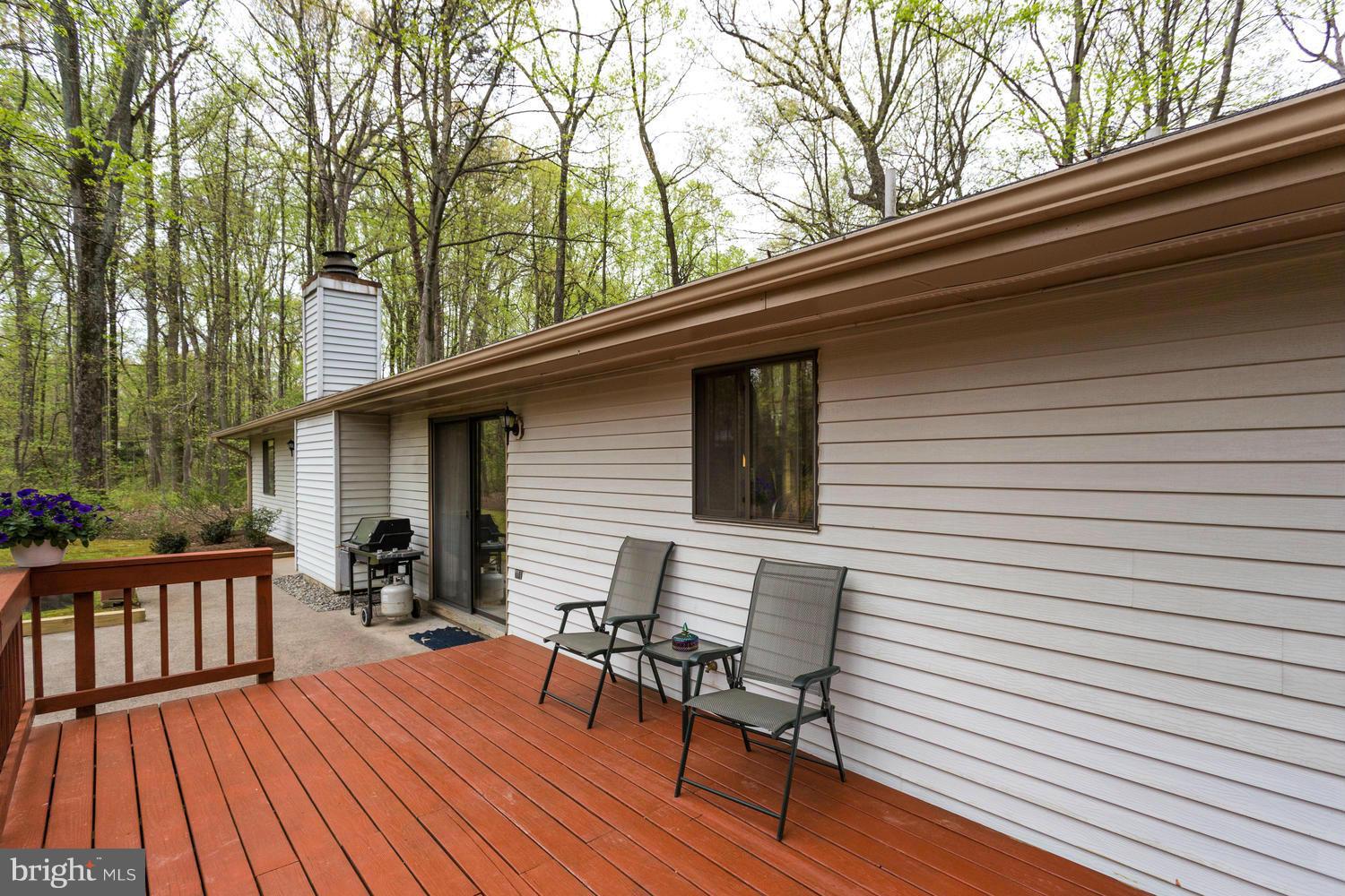 12348 Lima Lane Reston, VA 20191 - Photo 25 of 26 a view of backyard with a deck and wooden floor