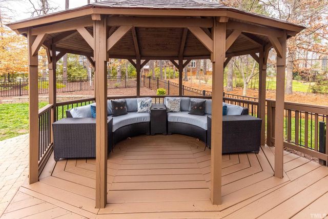 a view of porch with a bench and furniture