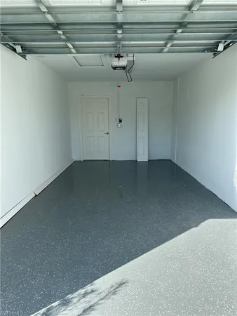 a view of swimming pool with a garden and seating area