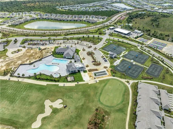 a view of swimming pool with a lawn chairs