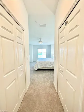 a view of a closet area with living room