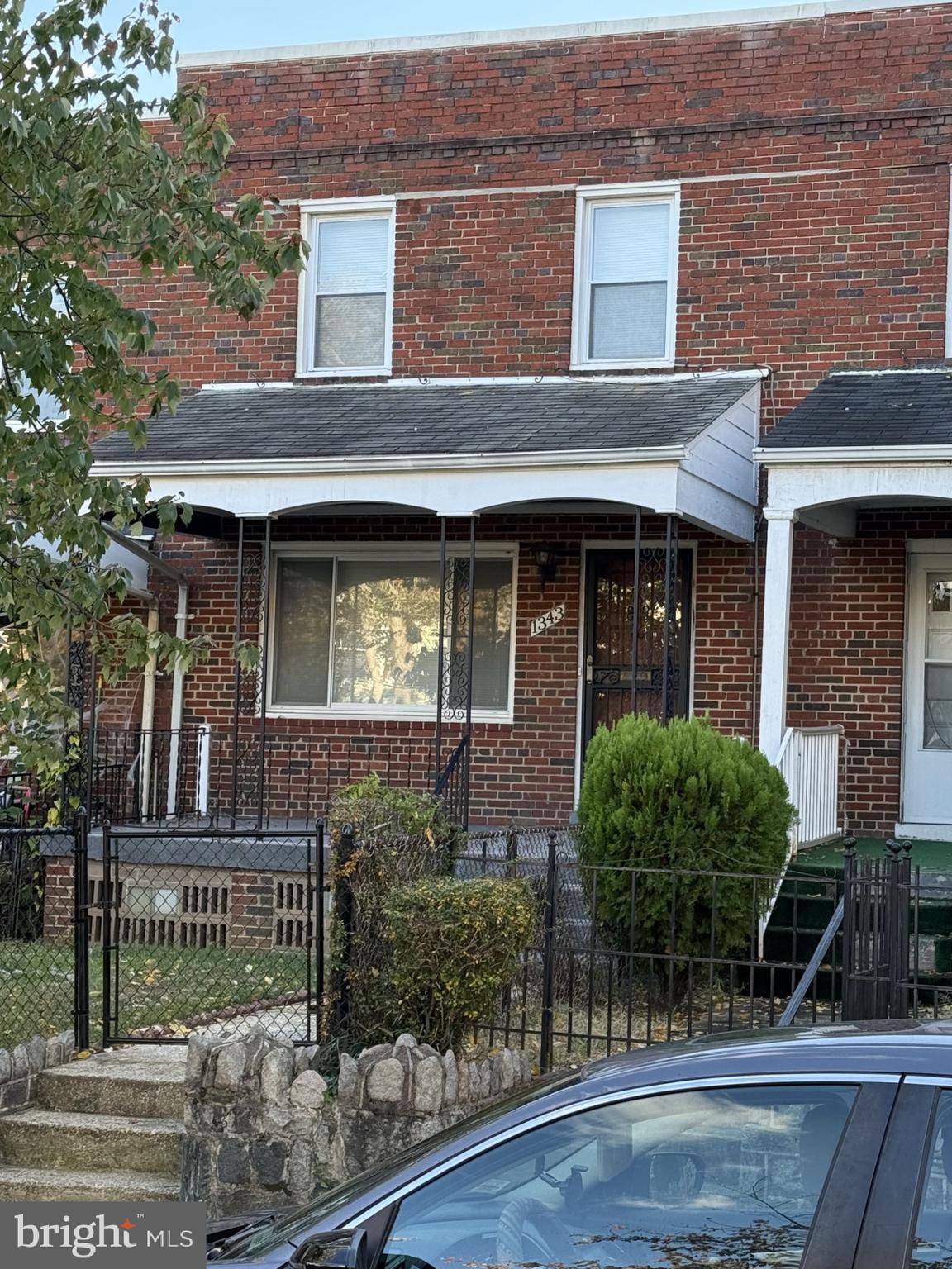 1343 Queen Street Northeast Washington, DC 20002 - Photo 1 of 6 a view of brick building with a tree in front