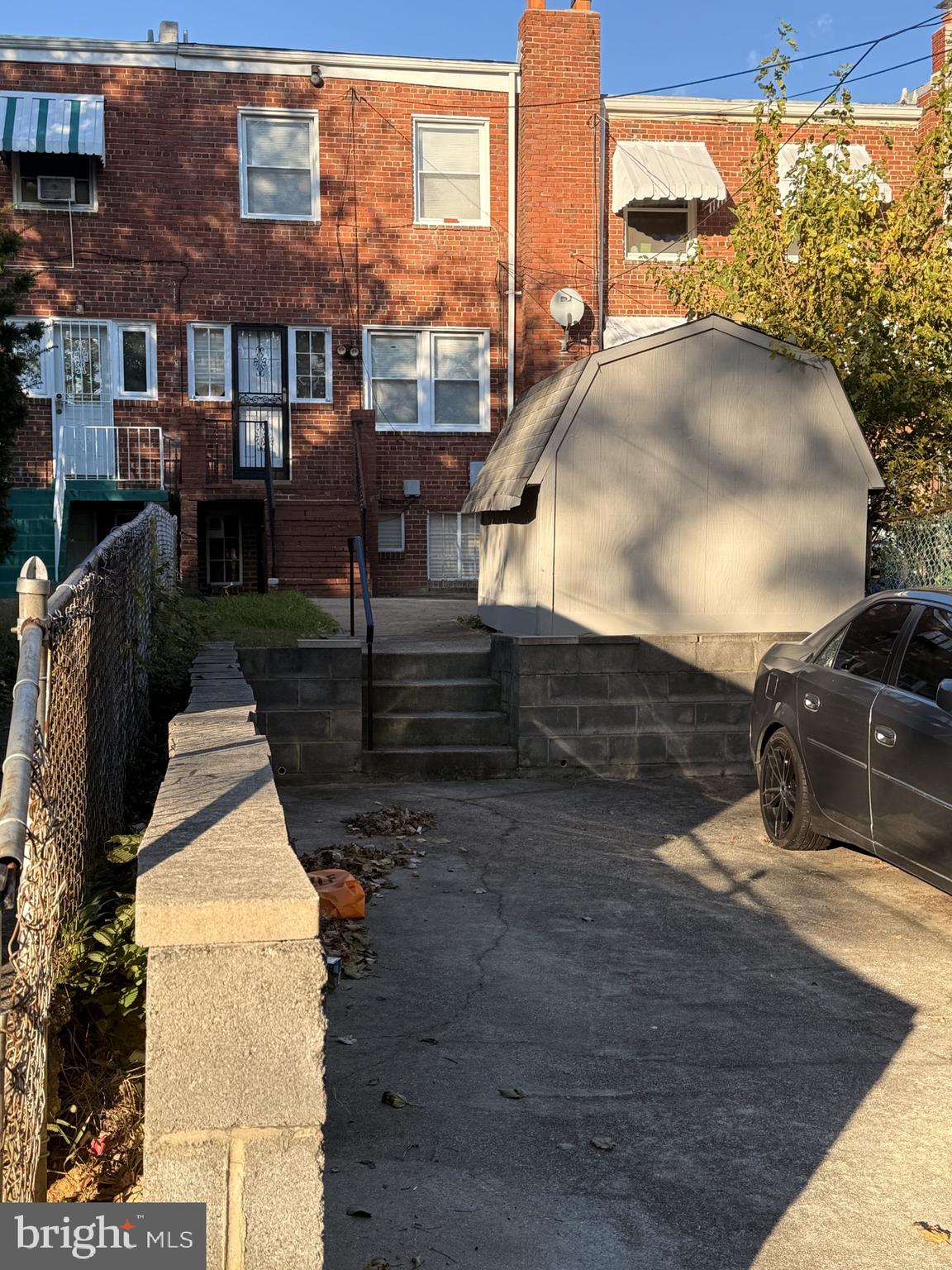 1343 Queen Street Northeast Washington, DC 20002 - Photo 6 of 6 a view of a balcony with couches and wooden floor