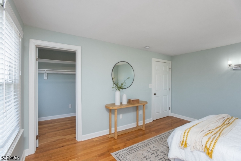 122 North Fullerton Avenue, Unit 2 Montclair, NJ 07042 - Photo 14 of 23 a bedroom with bed and wooden floor