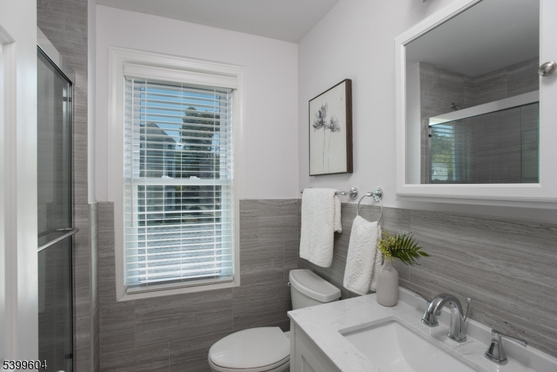 122 North Fullerton Avenue, Unit 2 Montclair, NJ 07042 - Photo 15 of 23 a bathroom with a sink and a mirror