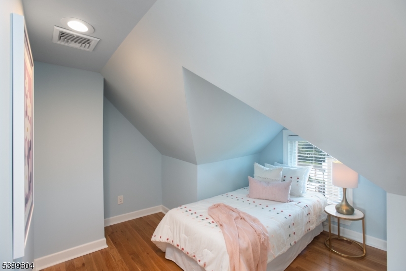 122 North Fullerton Avenue, Unit 2 Montclair, NJ 07042 - Photo 16 of 23 a bedroom with a bed and wooden floor