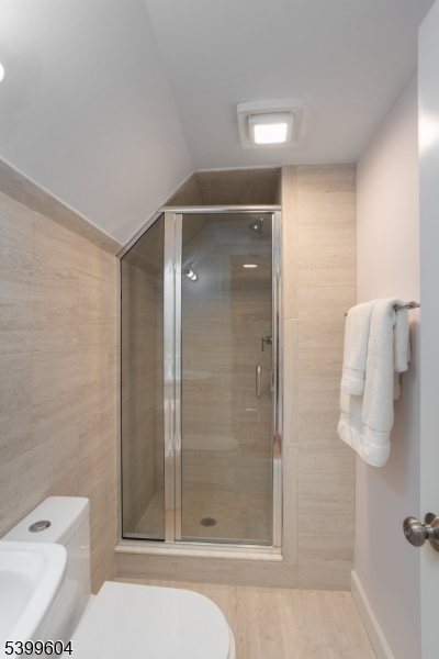 122 North Fullerton Avenue, Unit 2 Montclair, NJ 07042 - Photo 17 of 23 a bathroom with a shower and toilet