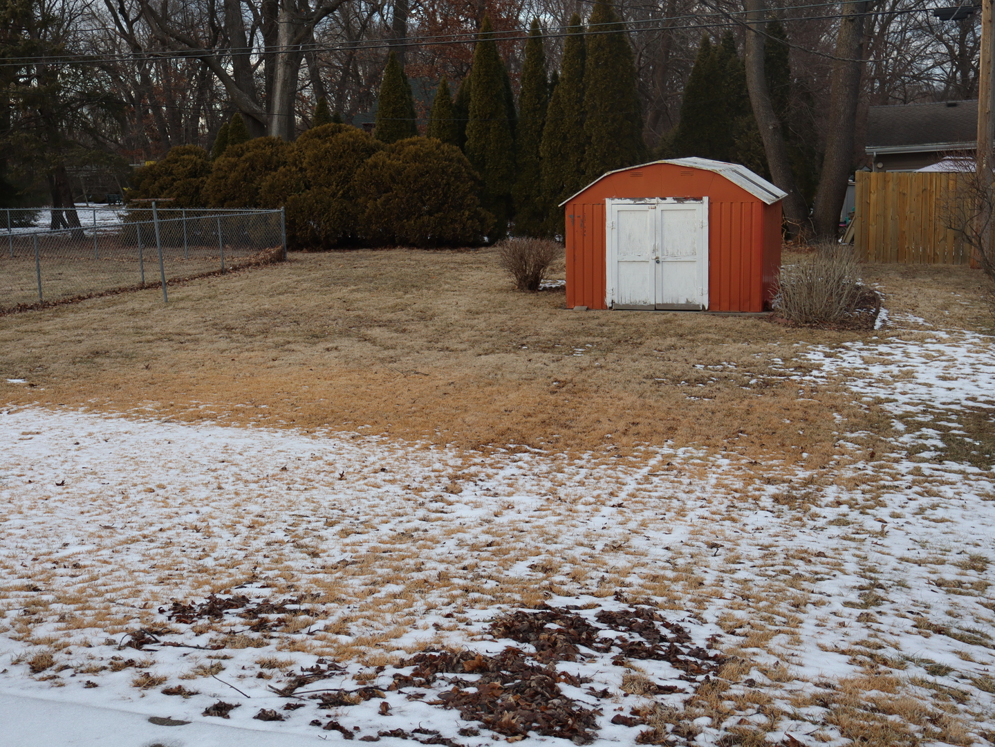 424 West Bluff Street Streator, IL 61364 - Photo 4 of 20 a view of a wooden house with a yard