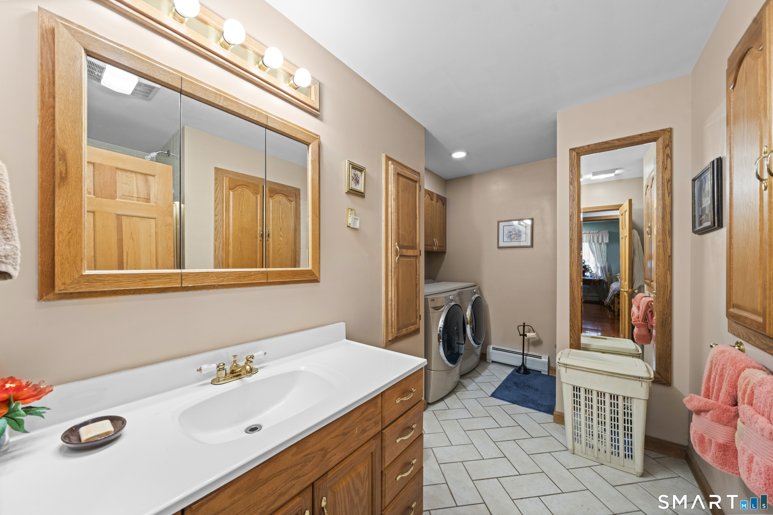 80 Holmes Road Goshen, CT 06756 - Photo 26 of 40 a bathroom with a tub sink and mirror