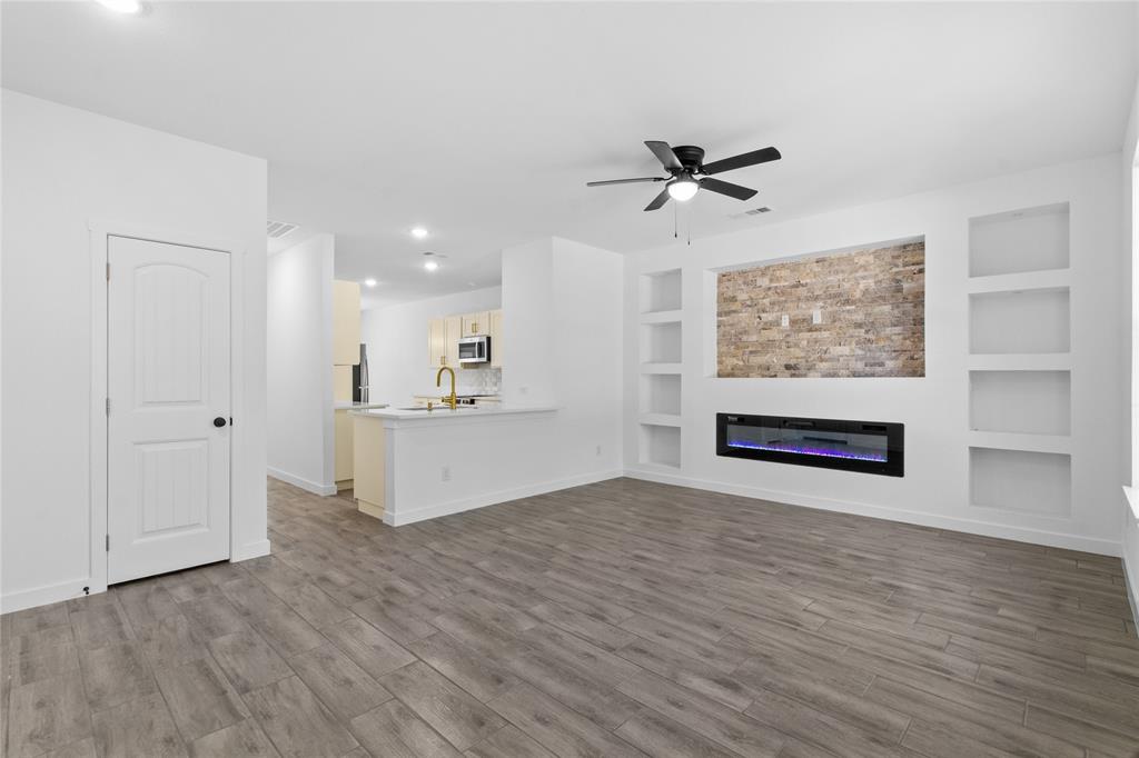 7520 Double Bridge Road Mabank, TX 75156 - Photo 11 of 32 Open-concept living space with wood-finish flooring