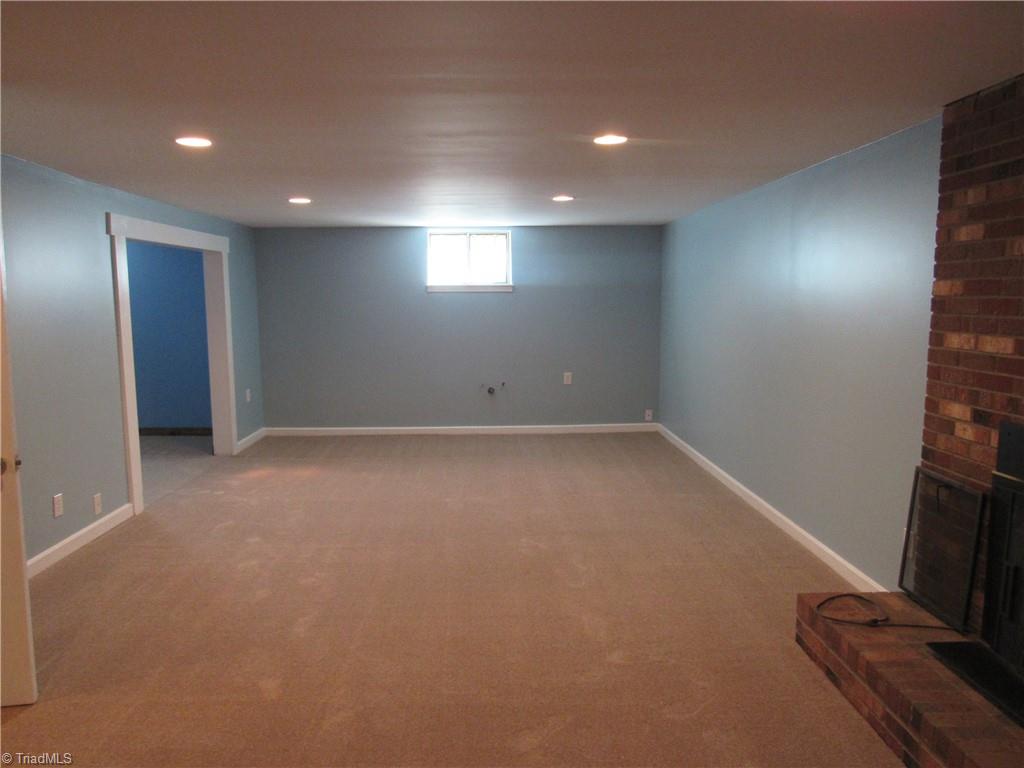 7067 Bridgewood Road Clemmons, NC 27012 - Photo 22 of 28 Basement Den W/fireplace