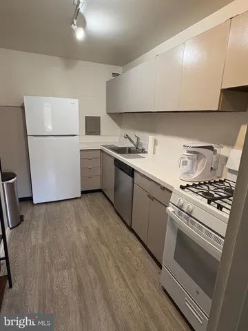 a kitchen with a stove and a refrigerator