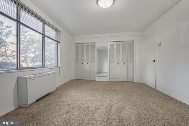 an empty room with windows