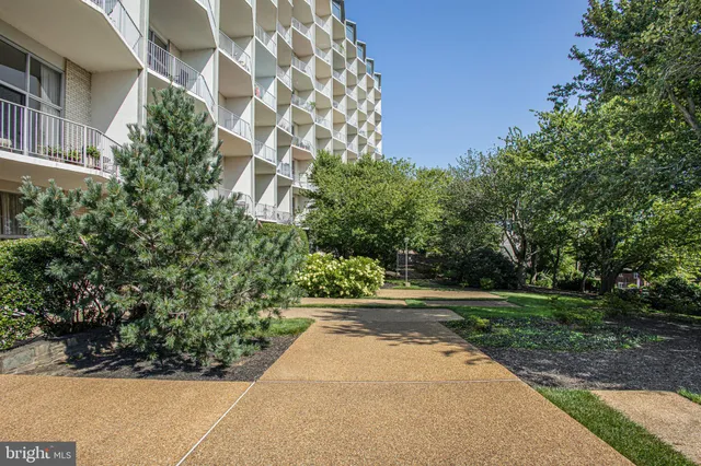 a view of a street with a building in the background