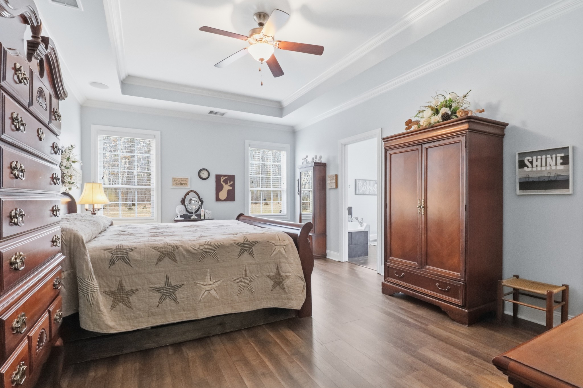 3287 Bluebird Road Lebanon, TN 37087 - Photo 19 of 64 a spacious bedroom with a bed and a chandelier