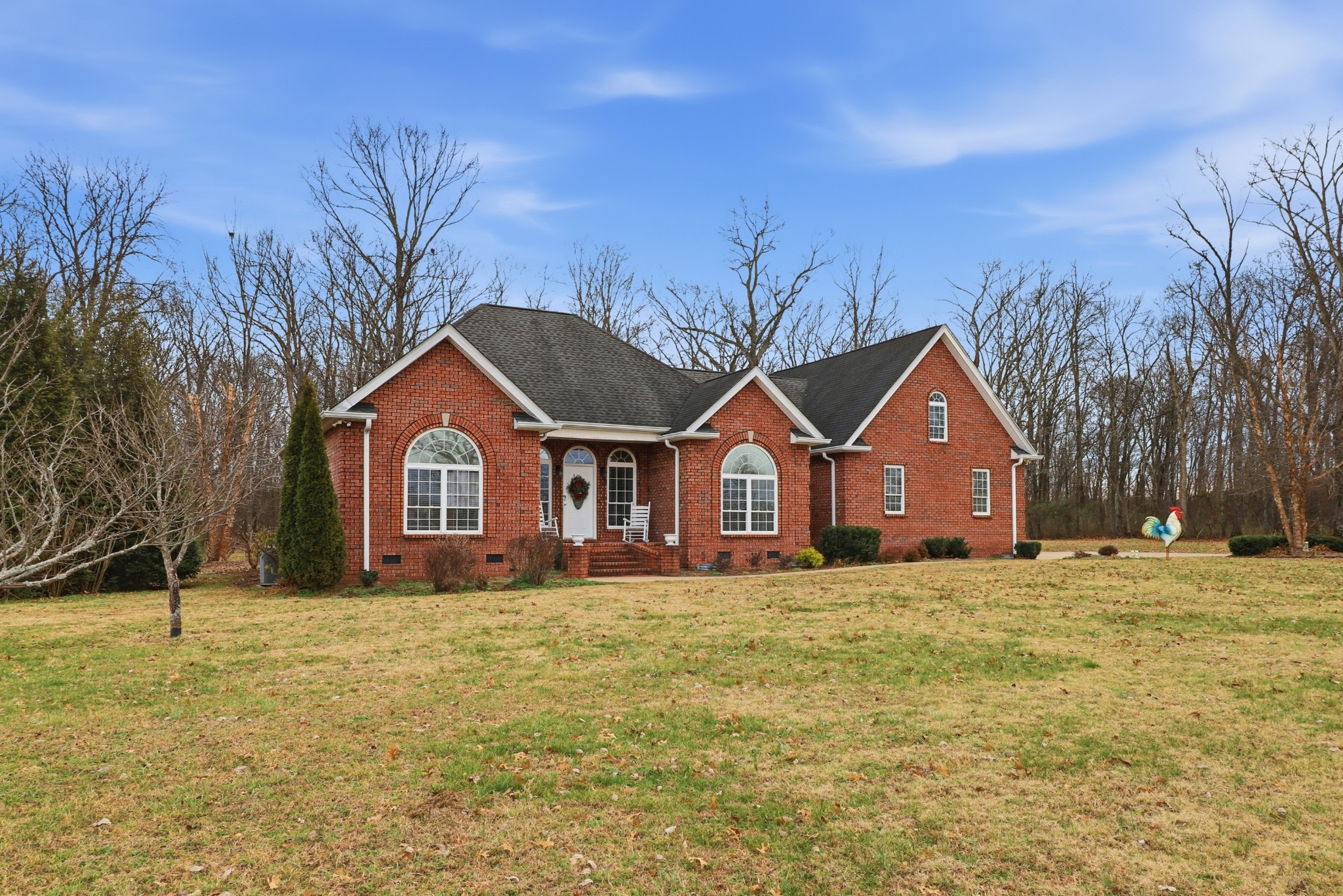 3287 Bluebird Road Lebanon, TN 37087 - Photo 3 of 64 a front view of a house with a yard and trees