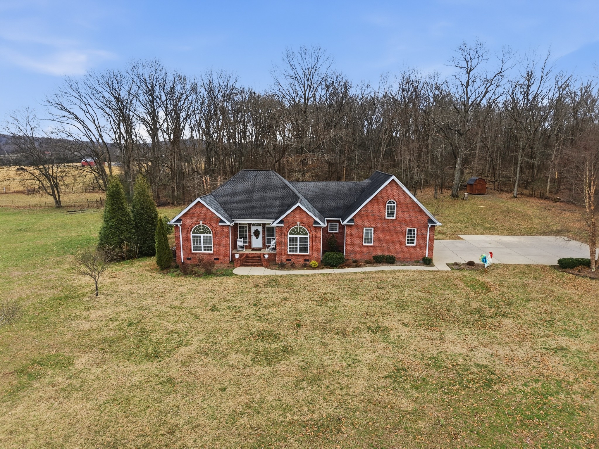 3287 Bluebird Road Lebanon, TN 37087 - Photo 44 of 64 a front view of a house with a yard and trees