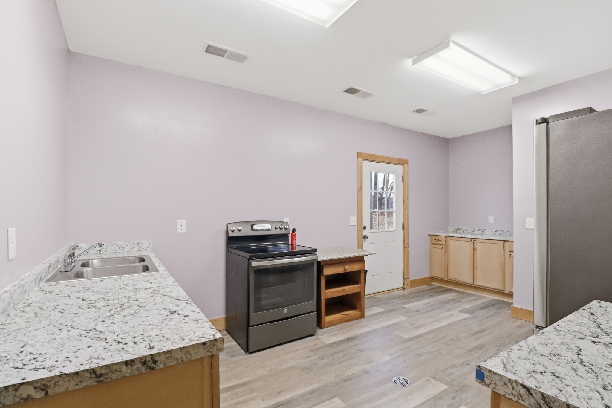 3287 Bluebird Road Lebanon, TN 37087 - Photo 56 of 64 a kitchen with a stove and a refrigerator