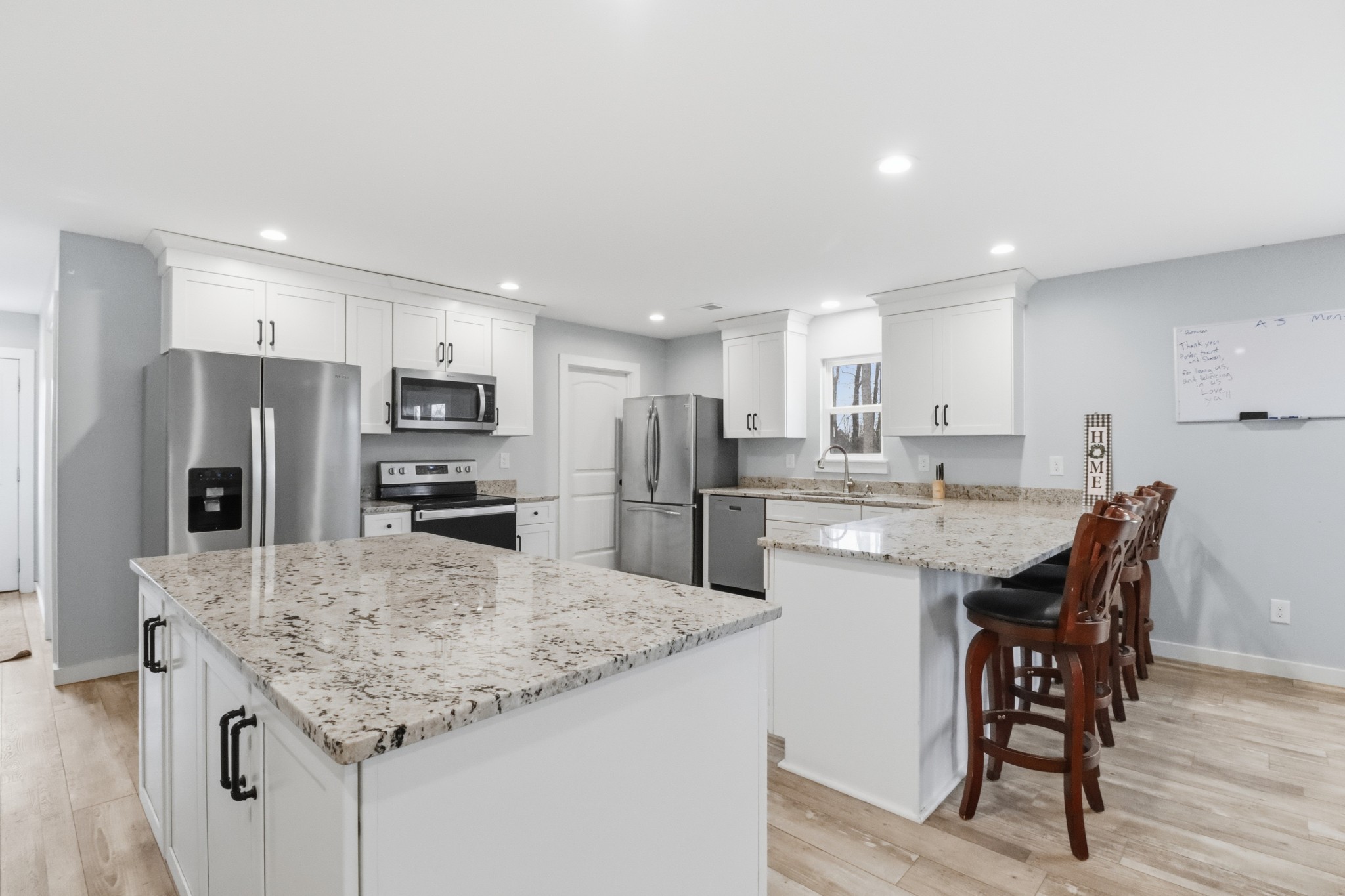 3287 Bluebird Road Lebanon, TN 37087 - Photo 61 of 64 a kitchen with refrigerator and chairs