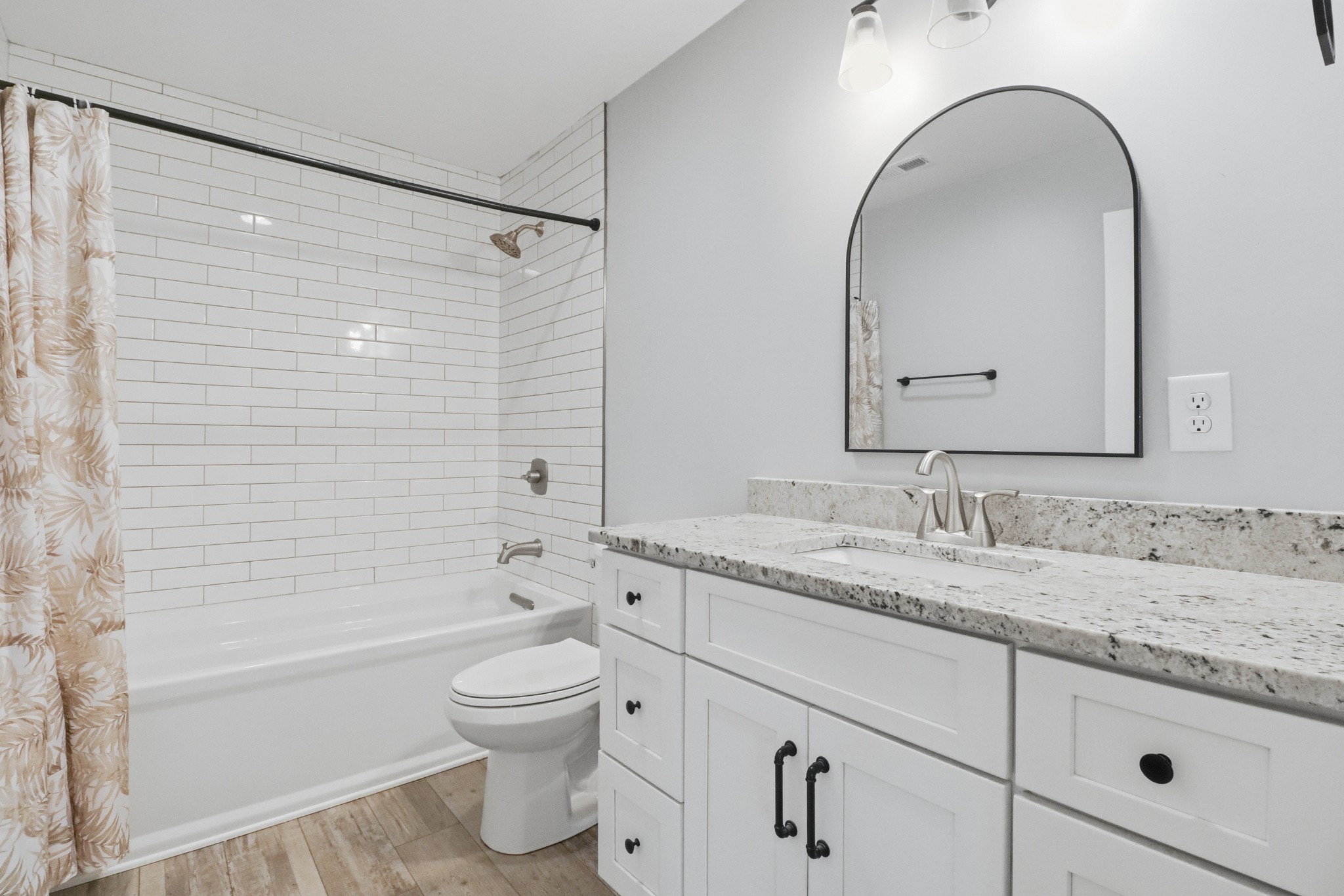 3287 Bluebird Road Lebanon, TN 37087 - Photo 63 of 64 a bathroom with a granite countertop sink a toilet and a bathtub