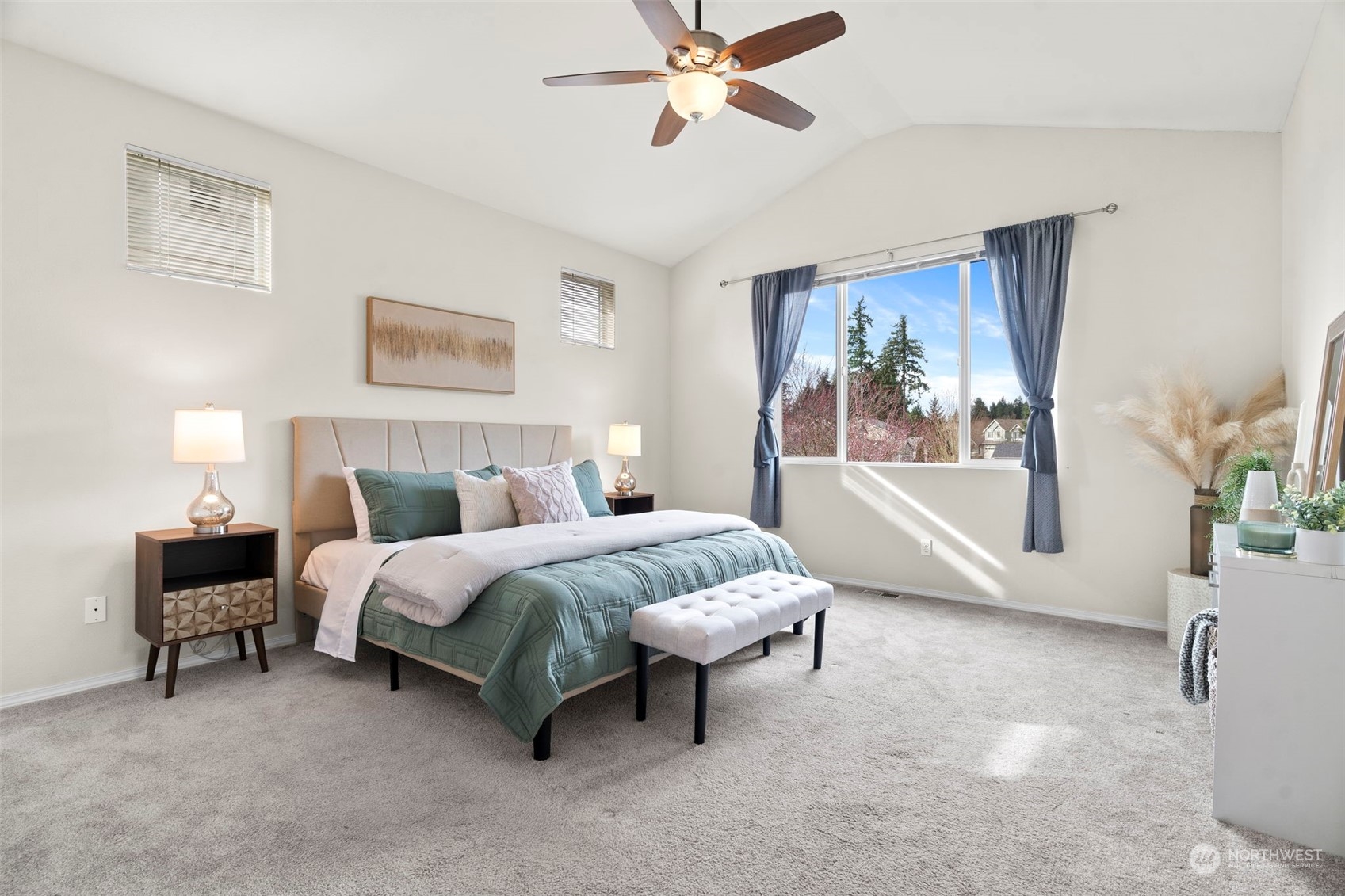 9175 Periwinkle Loop Northeast Lacey, WA 98516 - Photo 12 of 29 a spacious bedroom with a bed and a chandelier