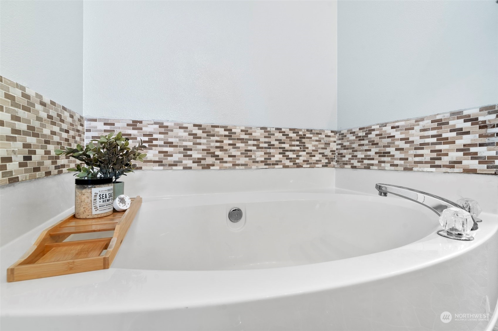 9175 Periwinkle Loop Northeast Lacey, WA 98516 - Photo 16 of 29 a bath tub sitting in a bathroom