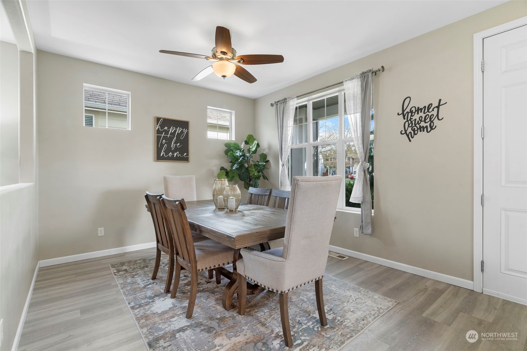 9175 Periwinkle Loop Northeast Lacey, WA 98516 - Photo 2 of 29 a view of a dining room with furniture and window