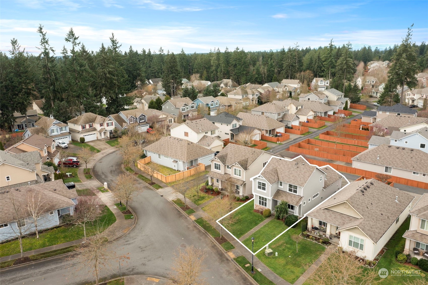 9175 Periwinkle Loop Northeast Lacey, WA 98516 - Photo 25 of 29 an aerial view of a house with a yard and lake view
