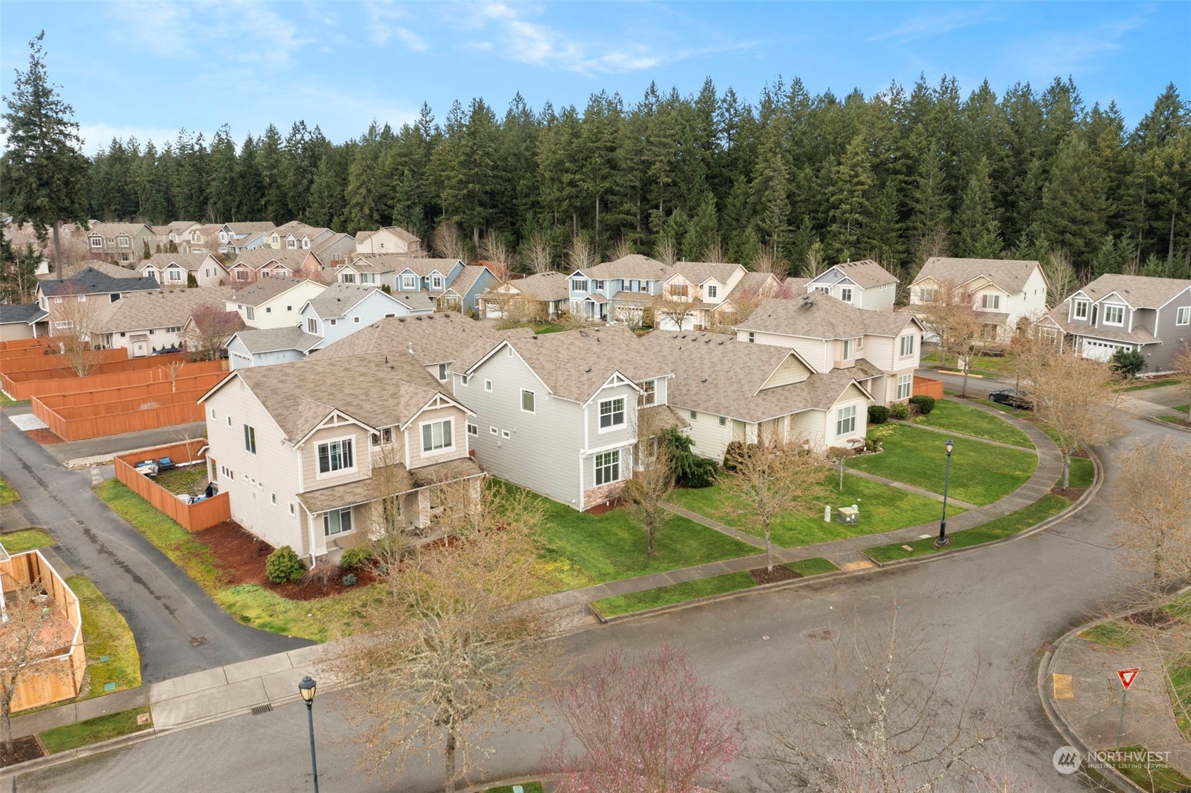 9175 Periwinkle Loop Northeast Lacey, WA 98516 - Photo 26 of 29 a view of a house with a big yard