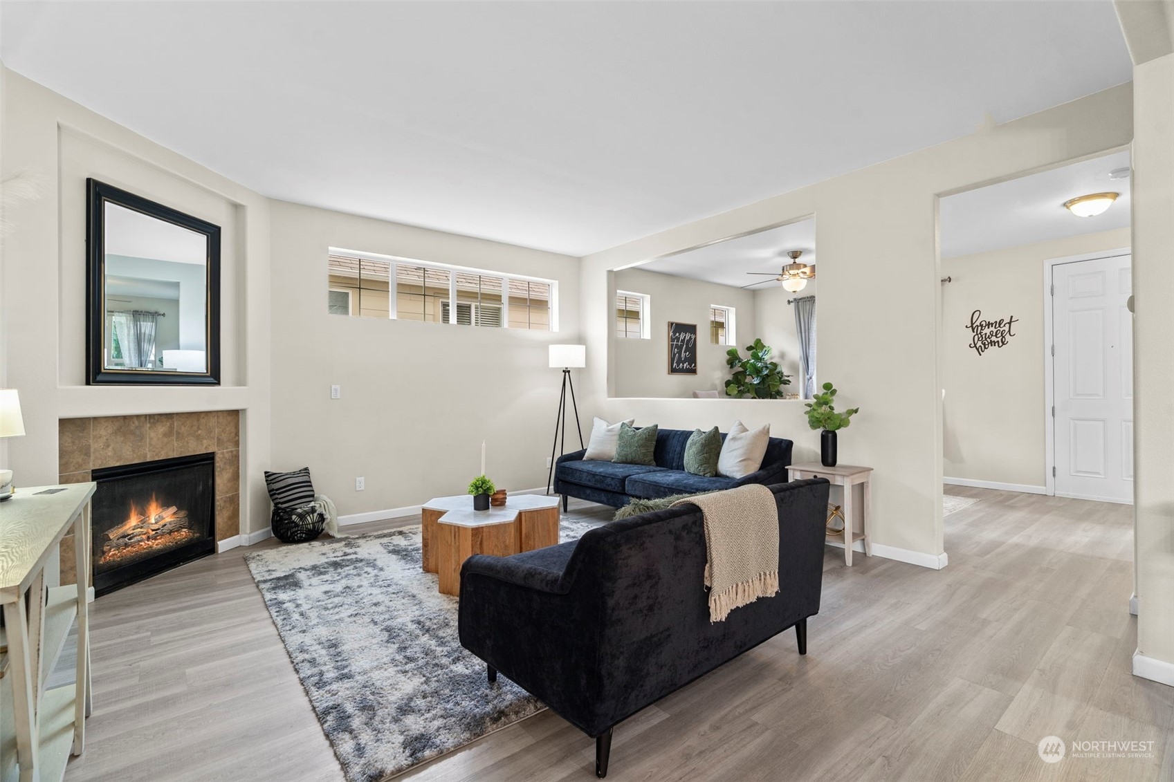 9175 Periwinkle Loop Northeast Lacey, WA 98516 - Photo 4 of 29 a living room with furniture and a fireplace