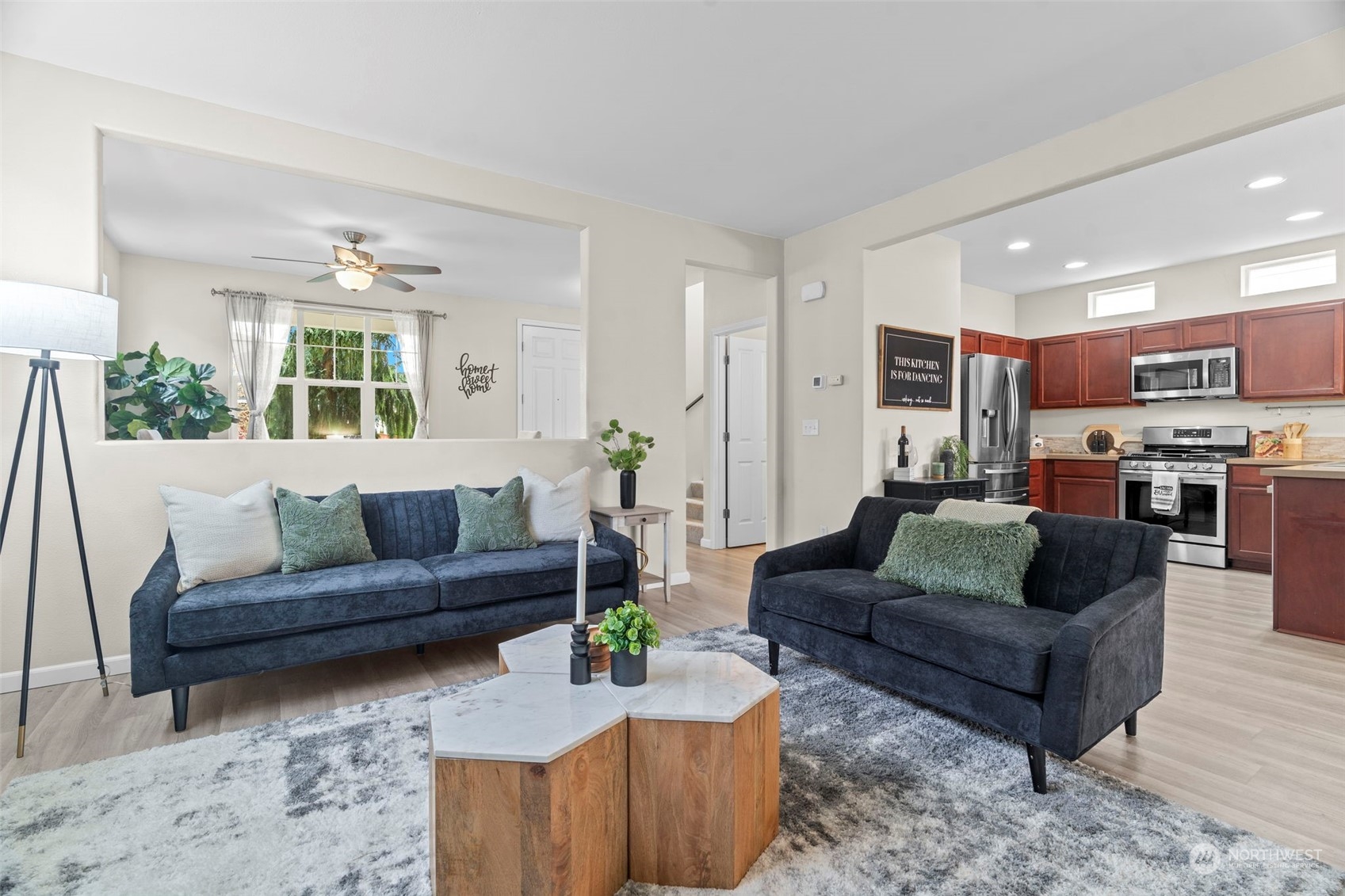 9175 Periwinkle Loop Northeast Lacey, WA 98516 - Photo 5 of 29 a living room with furniture and a fireplace