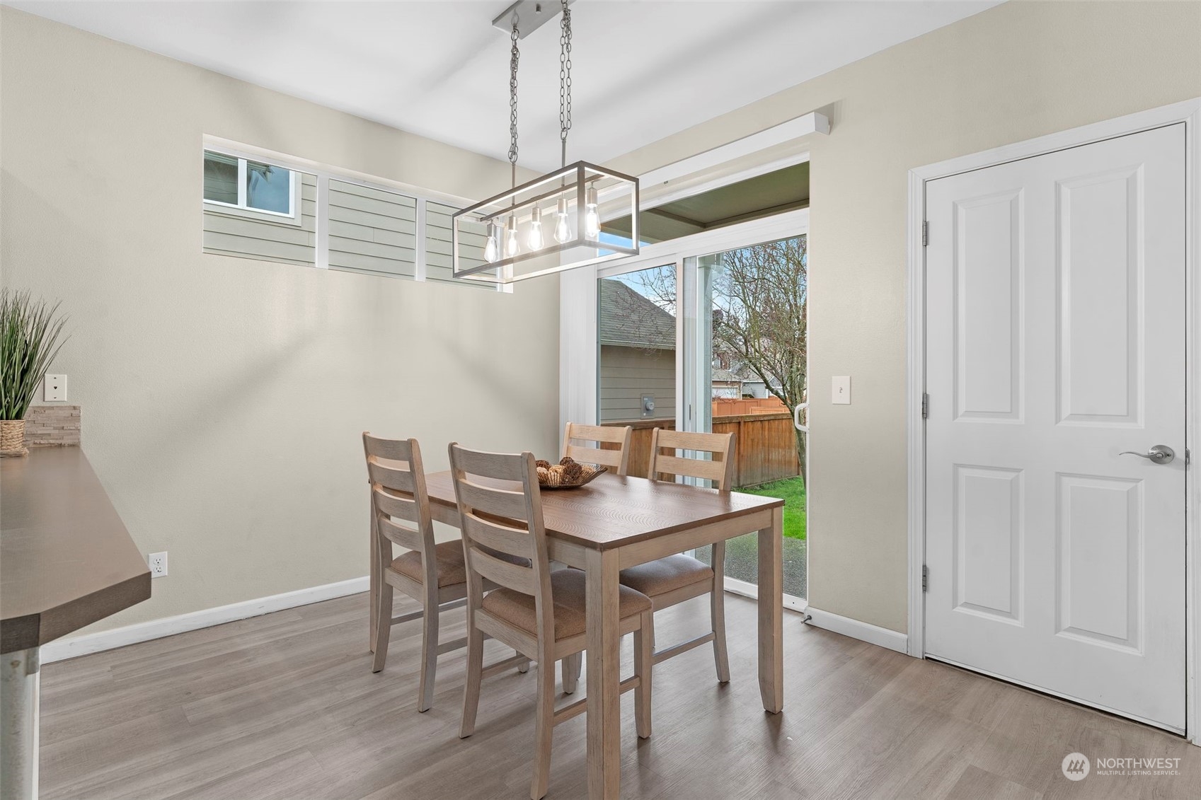 9175 Periwinkle Loop Northeast Lacey, WA 98516 - Photo 8 of 29 a view of a dining room with furniture window and wooden floor