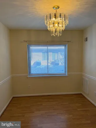 a view of a chandelier in big room