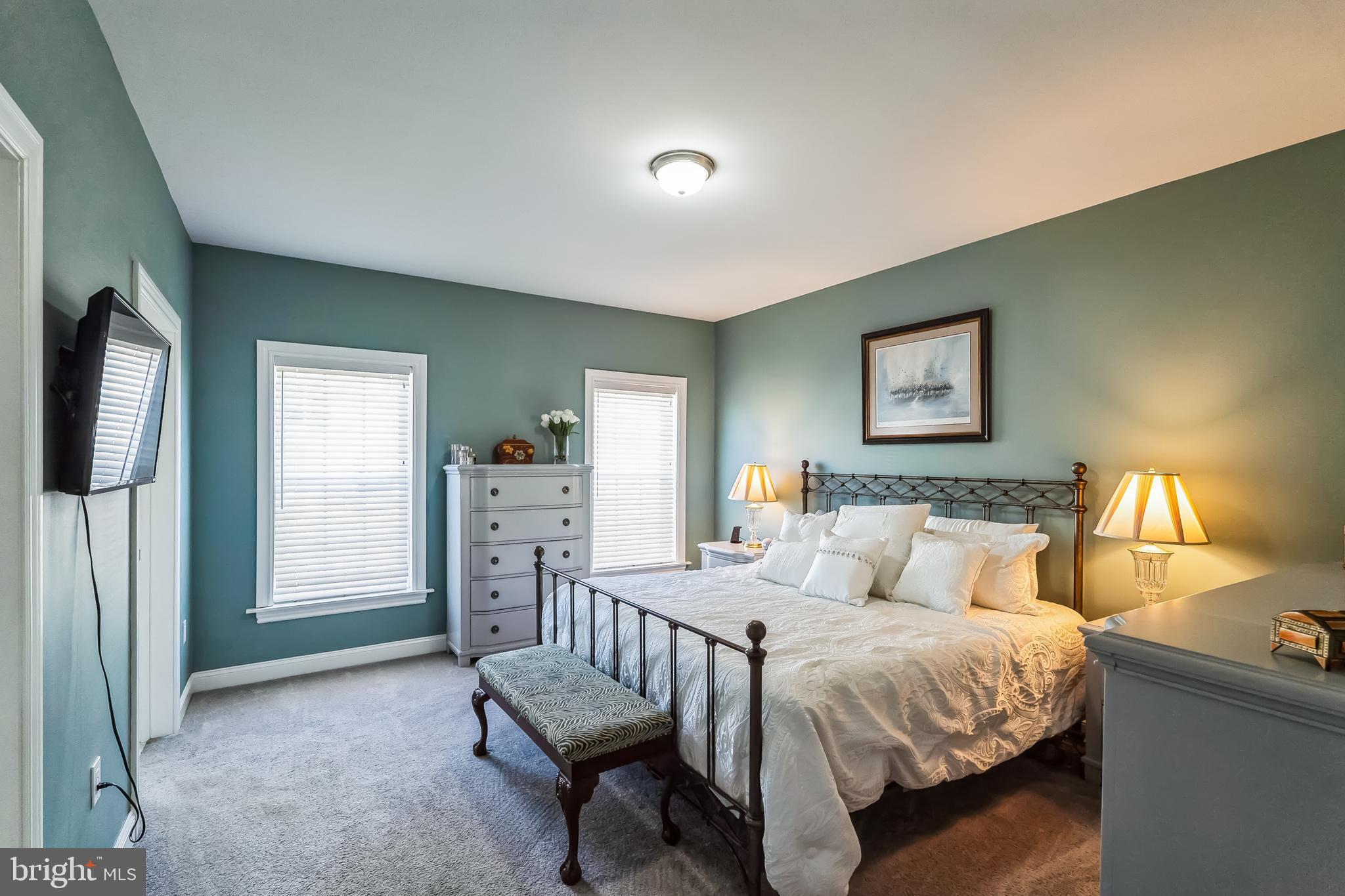 425 Azalea Drive Blue Bell, PA 19422 - Photo 14 of 26 a bedroom with a bed and a chandelier