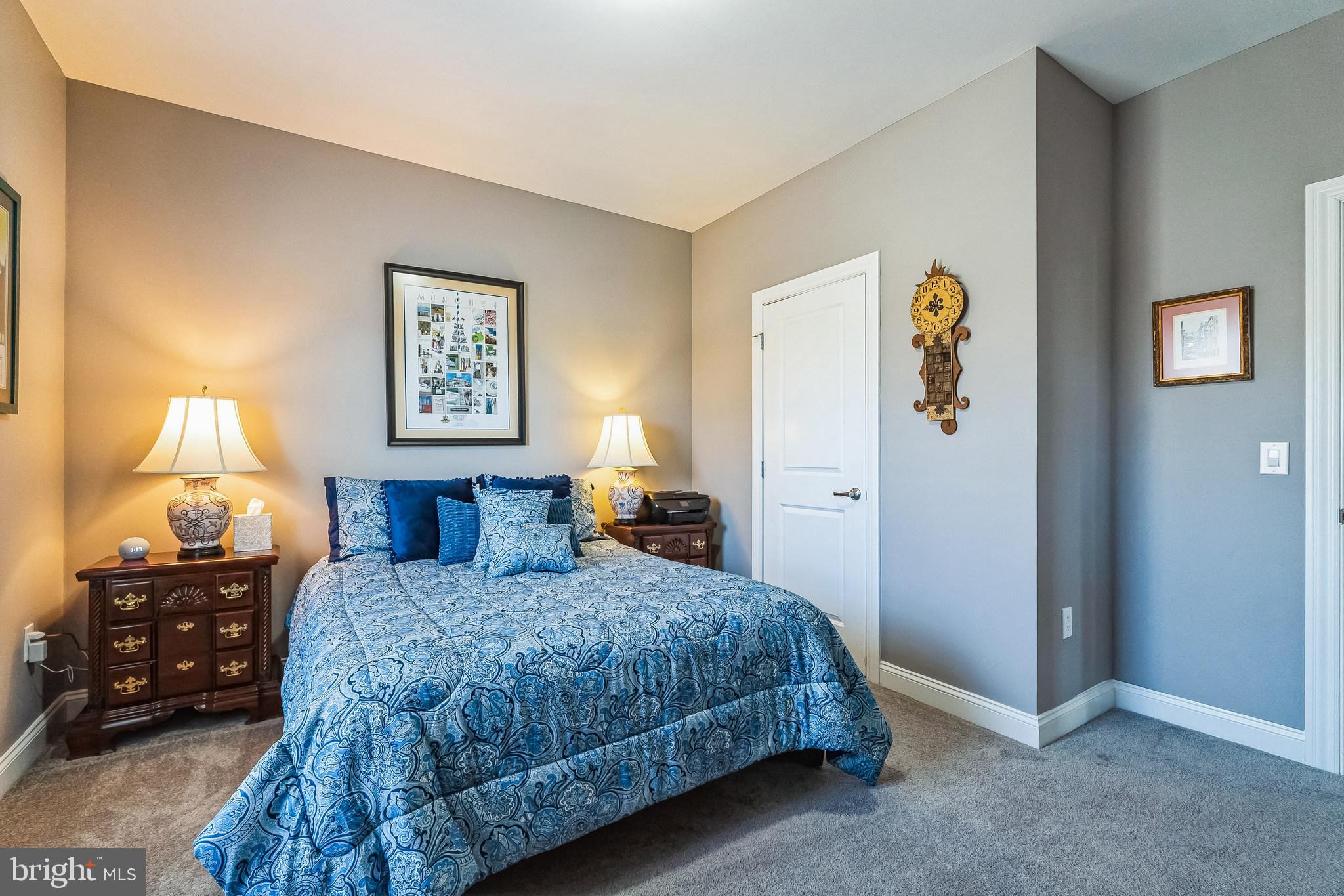 425 Azalea Drive Blue Bell, PA 19422 - Photo 21 of 26 a bedroom with a bed and a lamp on dresser