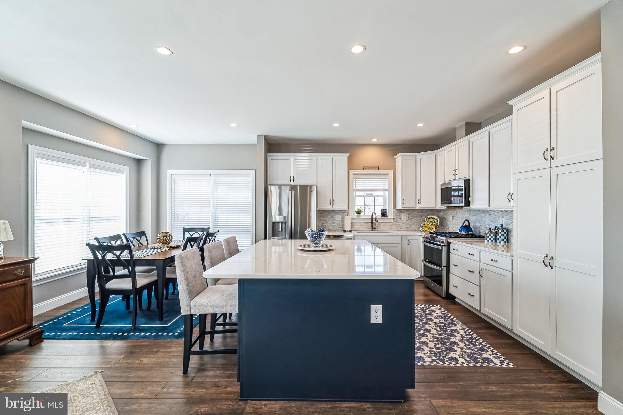 425 Azalea Drive Blue Bell, PA 19422 - Photo 5 of 26 a large kitchen with kitchen island a large island in the center
