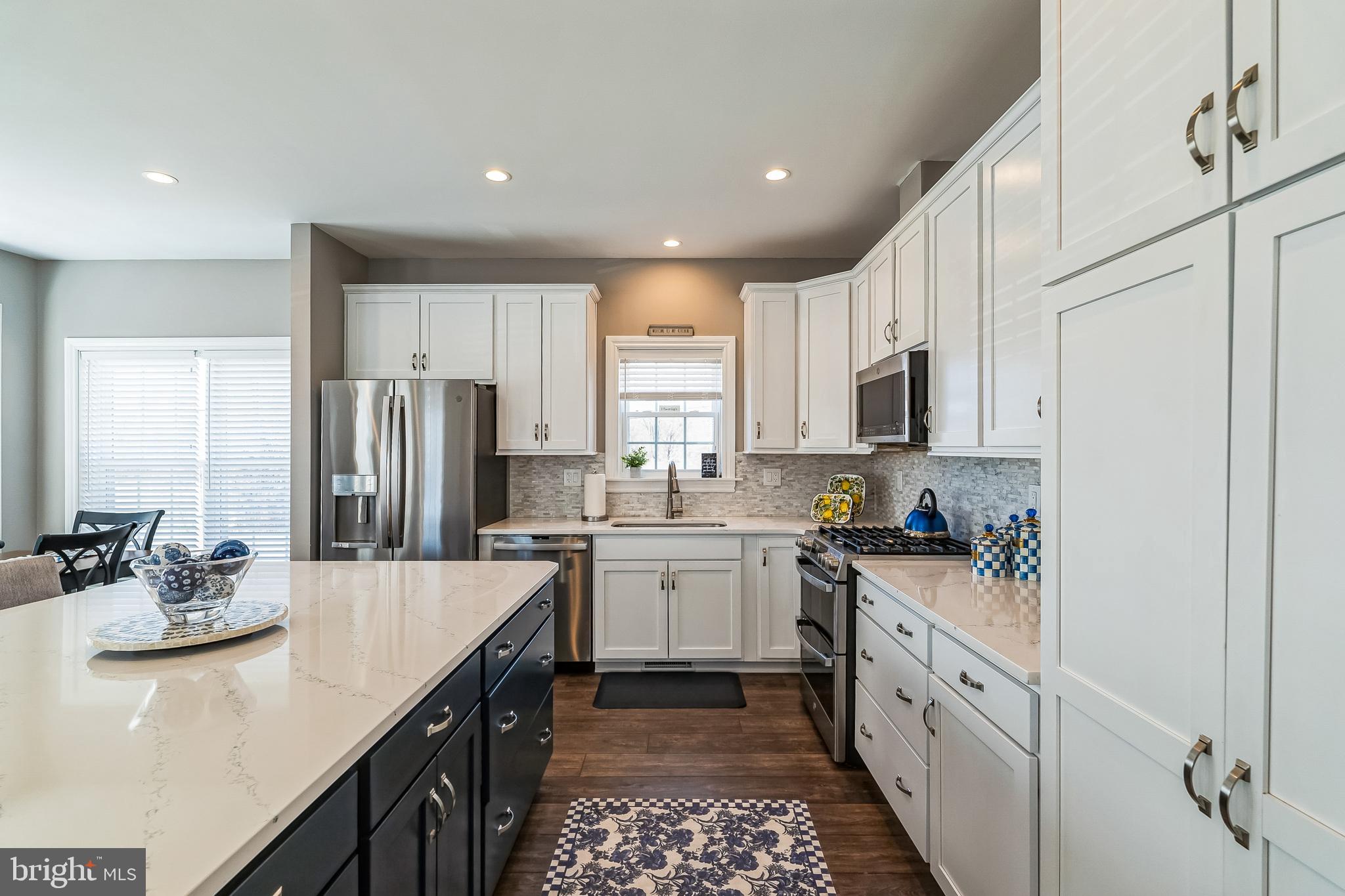 425 Azalea Drive Blue Bell, PA 19422 - Photo 7 of 26 a kitchen with a sink stove top oven and refrigerator