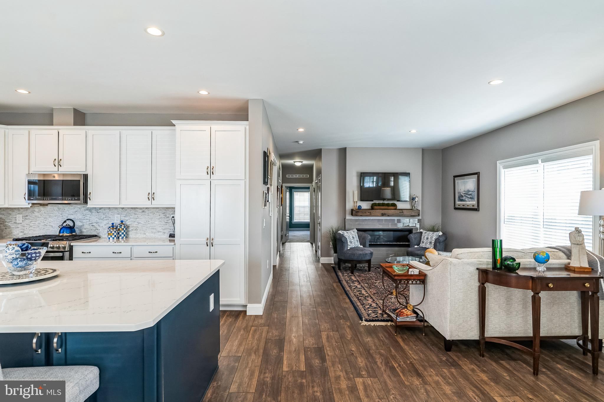 425 Azalea Drive Blue Bell, PA 19422 - Photo 9 of 26 a open kitchen with stainless steel appliances granite countertop a lot of counter space and wooden floor