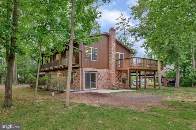 front view of a house with a tree