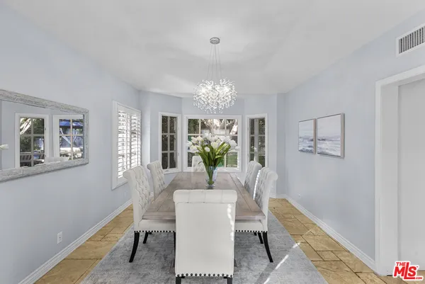 a living room with furniture and decor